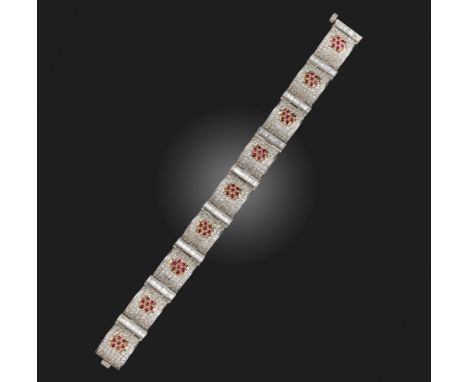 A ruby and diamond bracelet, the domed panels pave-set with diamonds and a cluster of rubies, each separated with a row of ba