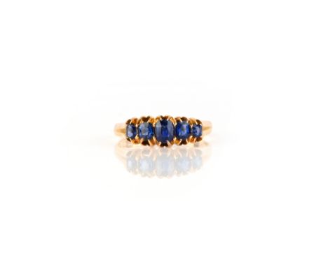 A five-stone sapphire ring, 19th century, set with five graduated oval sapphires, mounted in 18ct gold, size T1/2, British ha