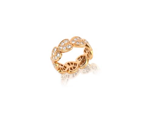 Cartier, a diamond-set heart ring, the nine linked hearts set overall with round brilliant-cut diamonds in yellow gold, rubbe