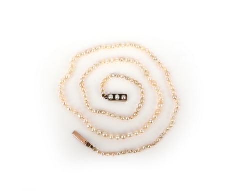 A natural pearl necklace, designed as a single row of natural pearls measuring approximately 2.7-4.3mm, to a clasp set with t