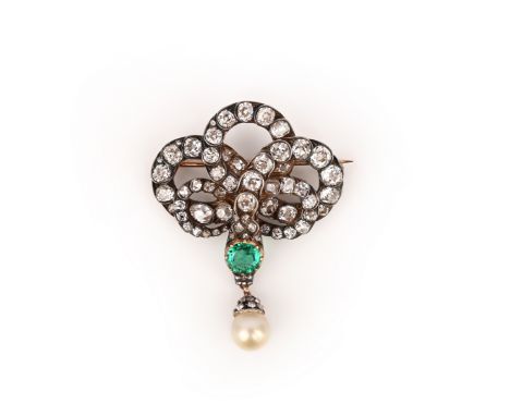 An emerald, diamond and pearl brooch, mid 19th century, designed as a coiled snake, its body set with circular- and rose-cut 