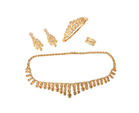 A gold and cubic zirconia parure, comprising: a necklace, a hinged bangle, a pair of earrings and a ring, each in yellow gold