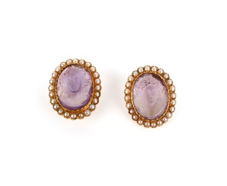 A pair of amethyst cameo and seed pearl earrings, mid 19th century, each of cluster design, set with a carved amethyst cameo 