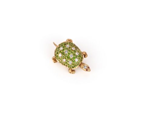 A demantoid garnet and diamond-set tortoise brooch, the stylised tortoise with ruby eyes, in textured yellow gold, 3.2cm long