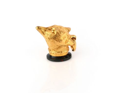 A gold and bloodstone fob seal charm, 19th century, designed as a fox head, the base set with a section of polished bloodston