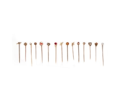 A collection of 15 stick pins, including a synthetic ruby and diamond stick pin, a reverse-carved crystal burgee stick pin an