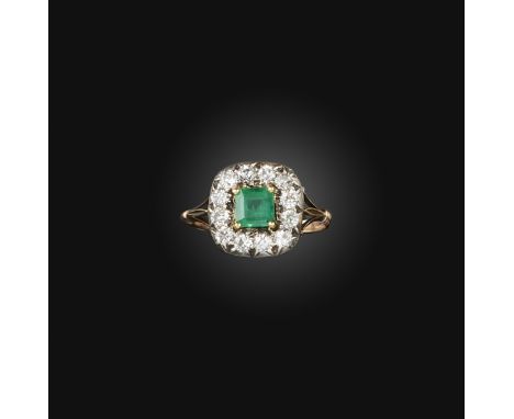 An emerald and diamond ring, 19th century and later, of cluster design, set with circular-cut diamonds surrounding a later ad