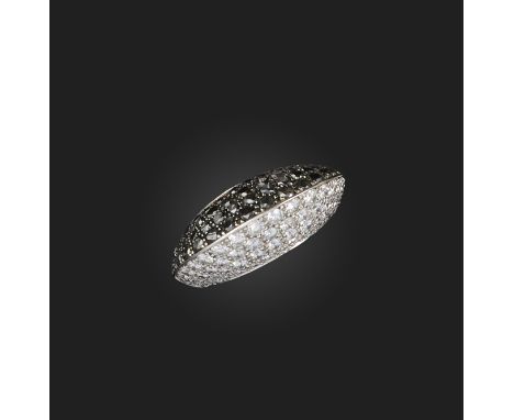 Chopard, a black and white diamond ring, of bombe form, half set with black diamond, the other half set with white diamonds i