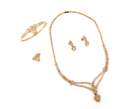 A gold and cubic zirconia parure, comprising: a necklace, bangle, ring and earrings, each pavé-set to the front with circular