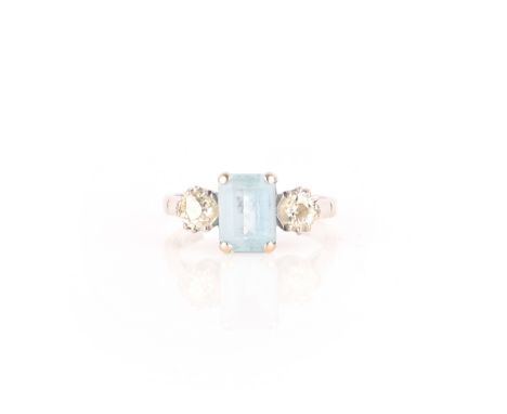 An aquamarine and diamond ring, claw-set in 18ct white gold with a step-cut aquamarine, between shoulders set with circular-c