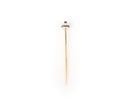 A pearl and diamond stick pin, late 19th century, capped with a pearl set with a band of rose-cut damonds, and topped with a 