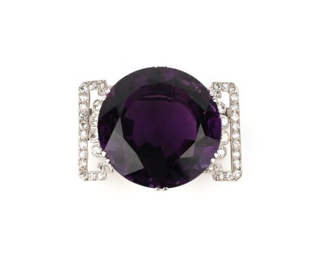 S.J. Rood, an Art Deco amethyst and diamond brooch, circa 1920, set with a large circular-cut amethyst, within a geometric br