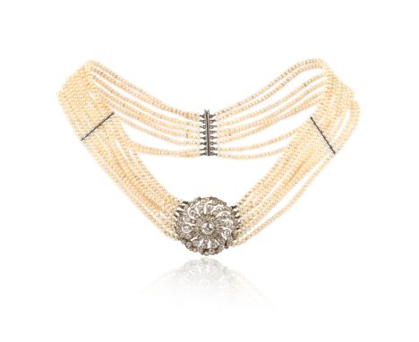 A diamond and seed pearl necklace, circa 1920, the centre designed as a swirled openwork cluster of circular-cut diamonds, mo