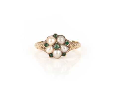 A Regency emerald and pearl cluster ring, with foliate engraved yellow gold shoulders and glazed locket compartment to revers