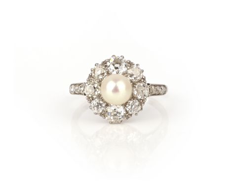 A natural pearl and diamond ring, early 20th century, of cluster design, set with a natural pearl measuring 5.9mm diameter, t