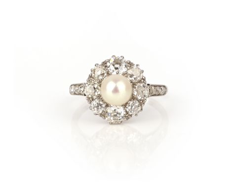 A natural pearl and diamond ring, early 20th century, of cluster design, set with a natural pearl measuring 5.9mm diameter, t