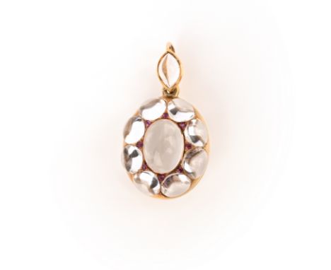 An unusual rock crystal and ruby locket, late 19th century, the gold locket of hinged design, the front and bail set with roc