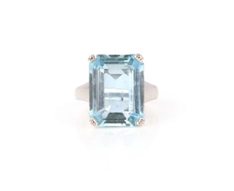 An aquamarine solitaire ring, claw-set with a step-cut aquamarine, to a tapering white gold shank, size O, stamped 750, maker