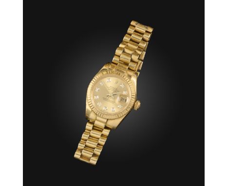 Rolex, a ladies gold Datejust wristwatch, signed champagne dial with diamond hour markers, date aperture, sweep seconds hand,