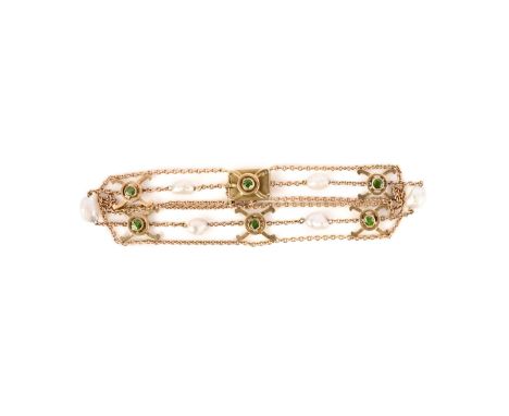 A pearl and demantoid garnet bracelet, early 20th century, designed as three gold chains connecting crossed links set with ci