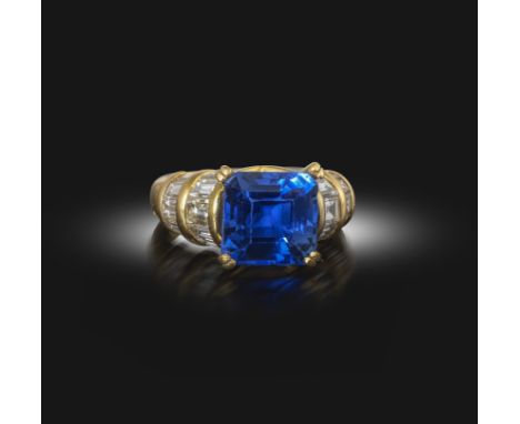 Monture Boucheron, a sapphire and diamond ring, claw-set with an octagonal step-cut sapphire weighing 4.83 carats, to an 18ct