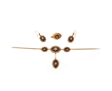 A pair late 19th century garnet and seed pearl necklace, on a chain, 43cm long, with a pair of matching garnet and seed pearl