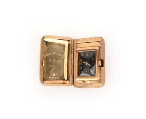 Asprey, a small 9ct gold travel clock, black rectangular dial with Arabic numerals and subsidiary seconds dial and, manual mo