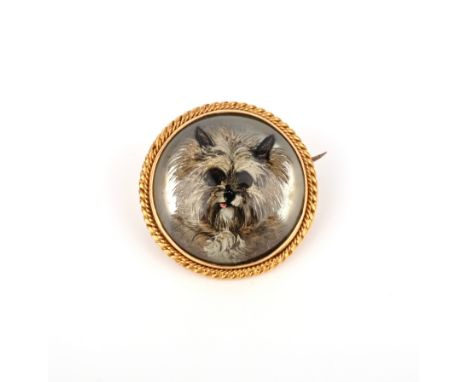 A rock crystal reverse intaglio brooch, late 19th century, the circular domed rock crystal carved in reverse and painted with