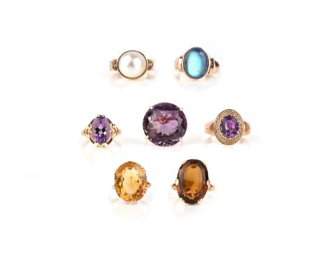 A group of seven gold and gem-set rings, comprising: three amethyst rings; two citrine rings; a cultured half pearl and diamo