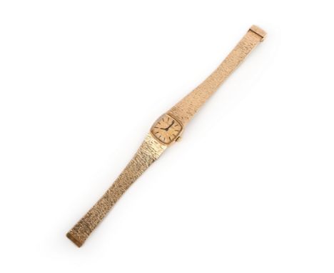 Beuche Girod, a lady's gold wristwatch, 1970s, the cushion-shaped dial of textured gold with black baton indicators and hands