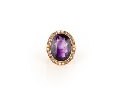 An amethyst, seed pearl and diamond ring, circa 1900, set with an oval amethyst, within a border of seed pearls and rose-cut 