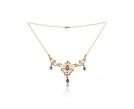 An Edwardian amethyst, seed pearl and demantoid garnet necklace, early 20th century, the front composed of sinuous scrollwork