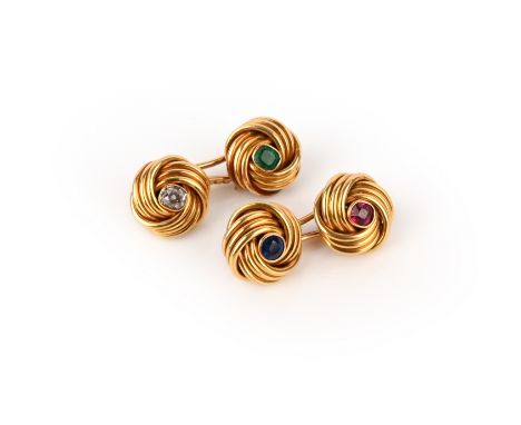 A pair of gold and gem-set cufflinks, mid 20th century, each end designed as a knot of gold wire, set with a circular-cut sap