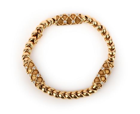 M Gerard, a gold and diamond bracelet, set with three diamond-set latticed plaques within fancy-link yellow gold chain, signe