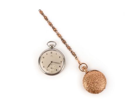 Two pocket watches, the first in gold, the exterior with engraved design of stars and swirls, opening to reveal a white ename