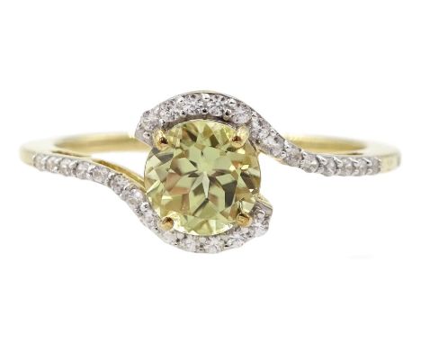 9ct gold round csarite and white zircon crossover ring, hallmarked Condition Report:Approx 2.1gm, size R-S, well presented ri