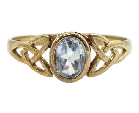9ct gold oval blue topaz ring, with pierced Celtic knot design shoulders, hallmarked Condition Report:Approx 1.8gm, size S, s