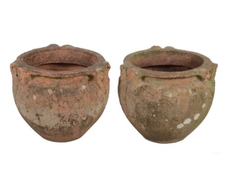  A pair of Compton Pottery garden urns,   early 20th century, of circular section, the rims each with three pairs of confront