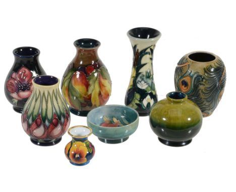  A group of small Moorcroft pieces,   comprising: Pansy, an enamel baluster vase, 2001, 4.7cm high, in a box; Leaves and Berr