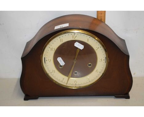 A retro dome topped mantel clock