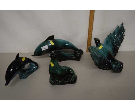 Canadian Blue Mountain Pottery models of a sea lion, eagle and dolphin together with a further Poole Pottery dolphin (4)