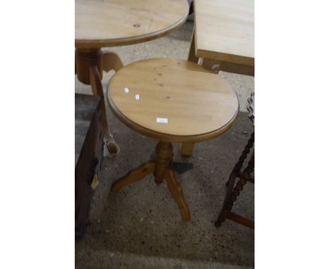 A pine wine table with circular top, turned column and tripod base