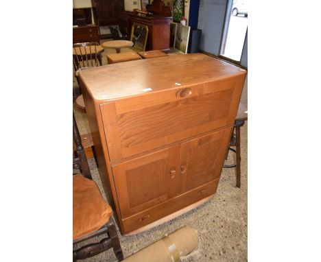 An Ercol light elm bureau or side cabinet with drop down front, two doors and a single base drawer