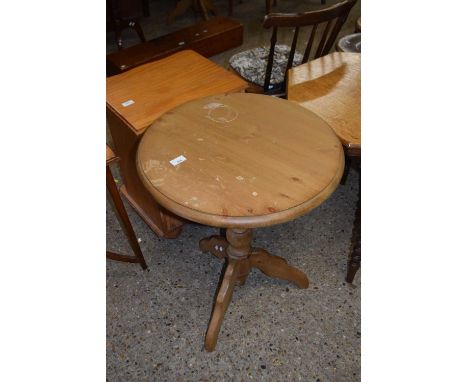 A pine wine table with circular top, turned column and tripod base