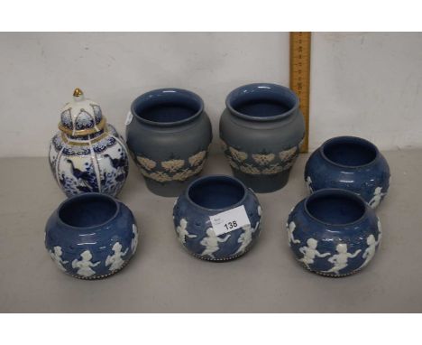Group of Lambeth Doulton wares including four small bowls with slip decorated children, an octagonal tea caddy decorated with
