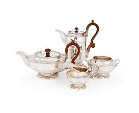 A silver four piece circular tea service by James Dixon &amp; Sons Ltd, Sheffield 1910 &amp; 1911, in the manner of Paul Stor