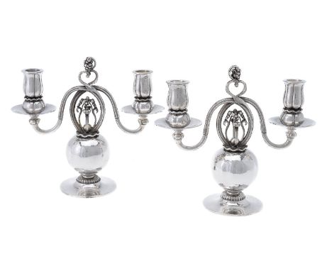 Georg Jensen, a pair of Danish silver Poppy twin light candelabra, post 1945 stamped marks, design no. 324, designed by Georg