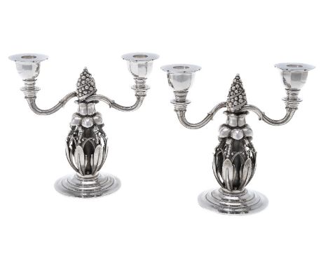 Georg Jensen, a pair of Danish silver Fir Cone twin light candelabra, post 1945 stamped marks, design no. 244, 21cm (8 1/4in)