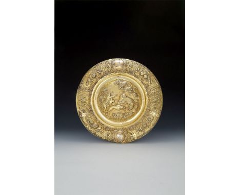 An early Victorian silver gilt circular sideboard dish or plaque by Edward Farrell, London 1838, the centre embossed with dog