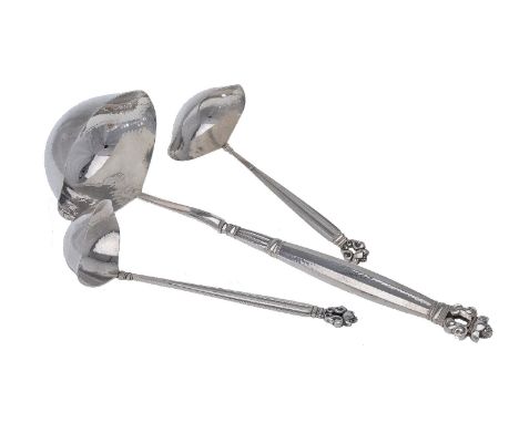 Georg Jensen, a Danish silver Acorn pattern soup ladle and two sauce ladles, post 1945 stamped marks, designed by Johan Rohde